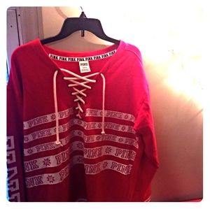 Pink throw over varsity sweater